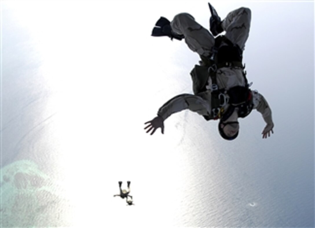 U.S. Air Force pararescuemen conduct a parachute training jump from an HC-130 aircraft over Djibouti, Africa, March 13, 2008. The airmen are assigned to the 82nd Search and Rescue Squadron from Moody Air Force Base, Ga.