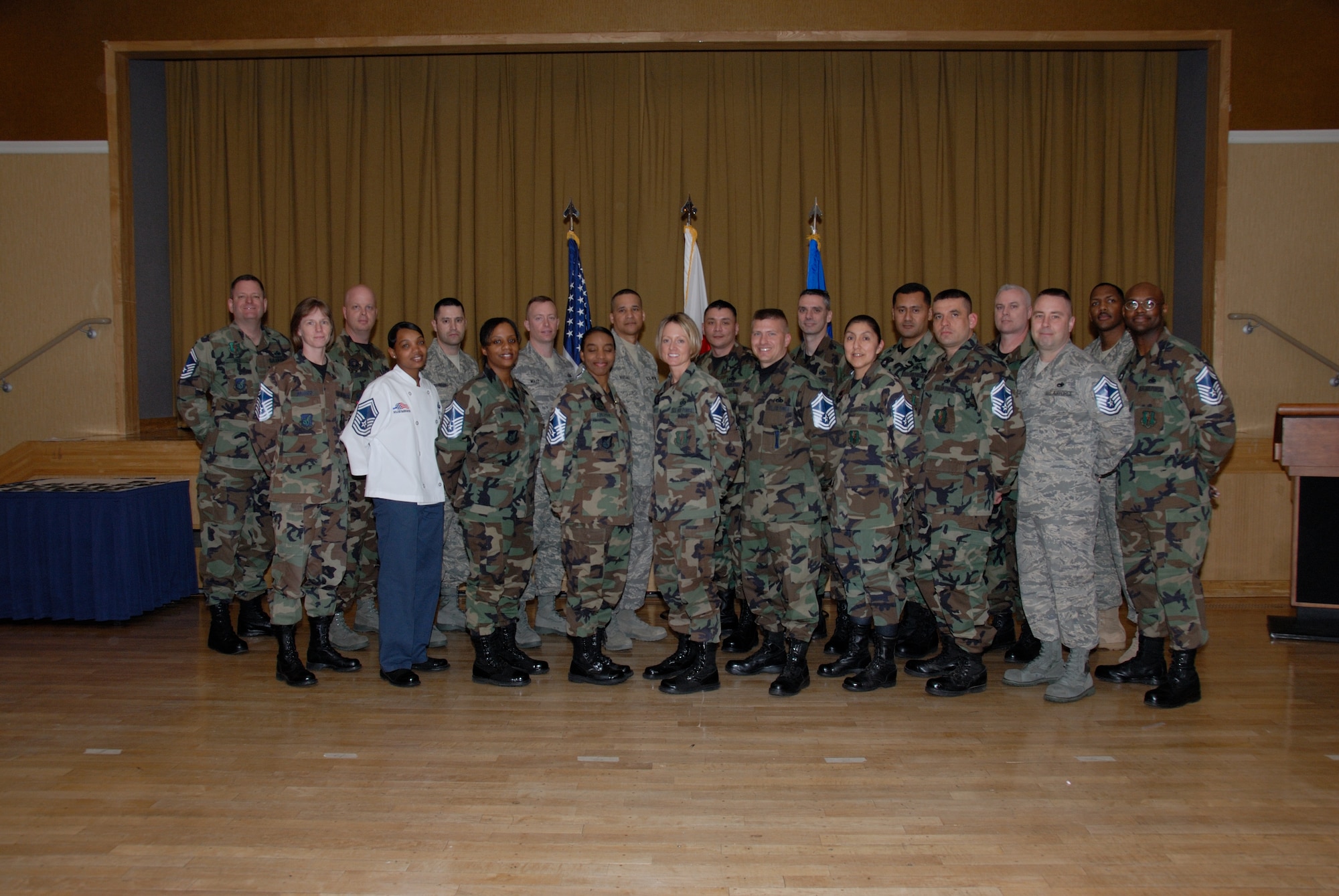 MISAWA AIR BASE, Japan -- Misawa's newest senior master sergeant selects pose for a group photo during a recognition ceremony at the club March 14. The Air Force had a 8.91 percent selection rate this year; 22 master sergeants from Misawa were selected. (U.S. Air Force photo by Senior Airman Laura R. McFarlane)