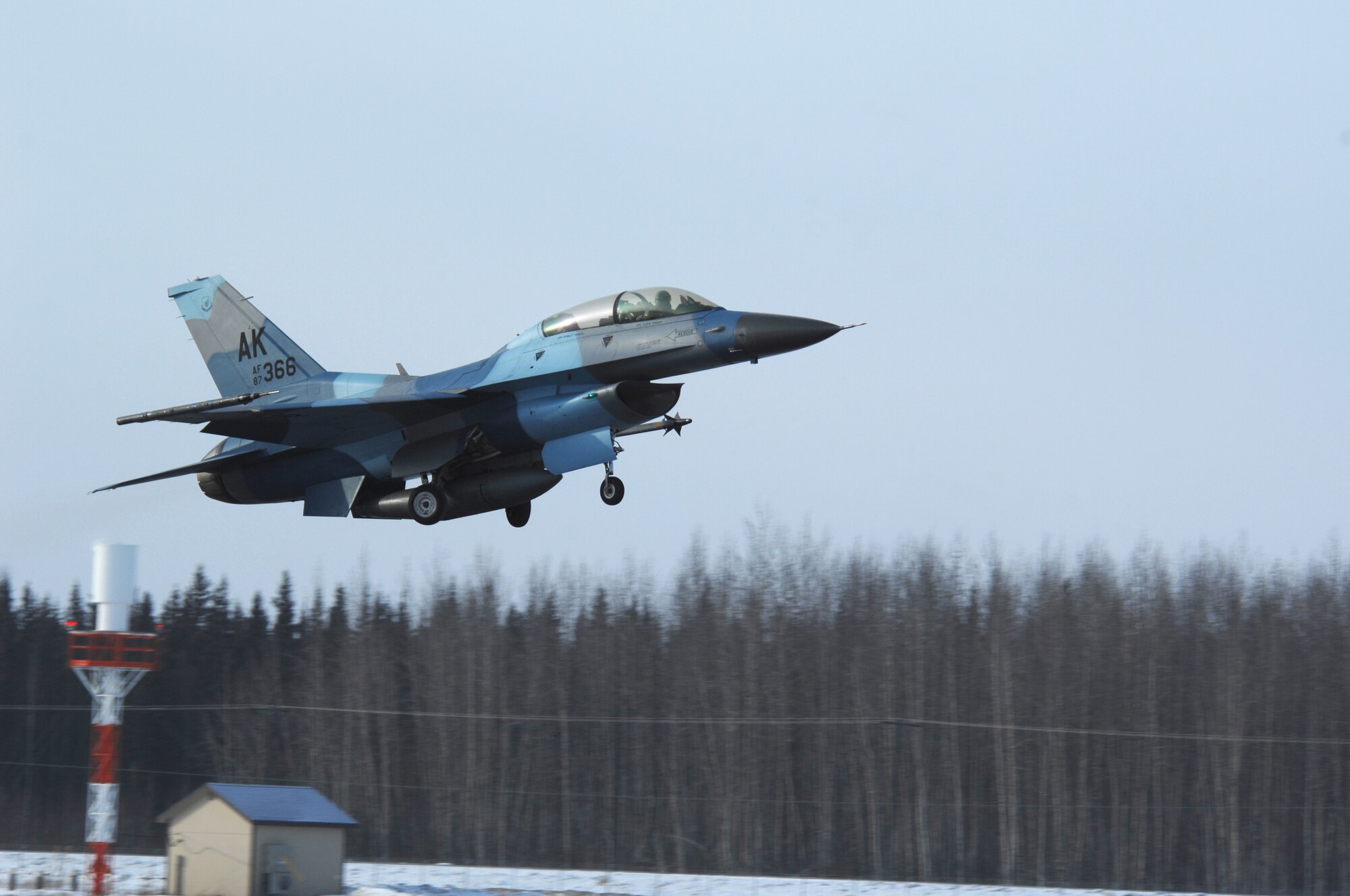 An F-16 Fighting Falcon 'Aggressor' with flanker color scheme takes off at Eielson Air Force Base, Alaska for a training mission over the Pacific Alaska Range Complex March 17. The 18th Aggressor Squadron's F-16 fly as the opposing force during Red Flag-Alaska exercises using enemy tactics, techniques and procedures to give a realistic simulation of aerial combat. (U.S. Air Force photo by Airman 1st Class Christopher Griffin)