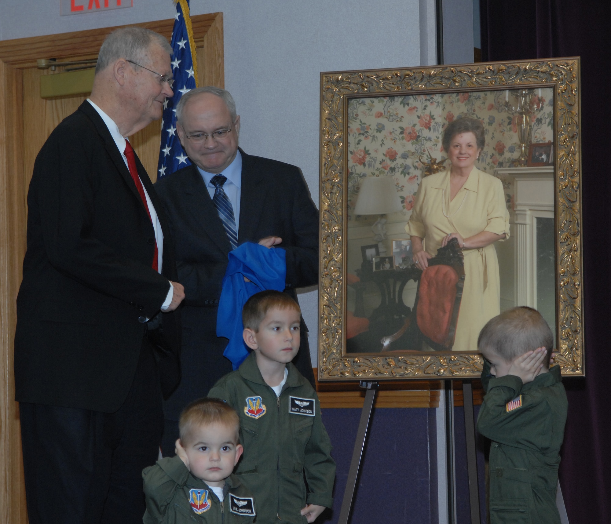 WHITEMAN AIR FORCE BASE, Mo. - Congressman Ike Skelton, left; Dale Buckingham, president of Whiteman’s Base Community Council; and three of Whiteman’s youngest, Matthew Johnson, 5; Nathan Johnson, 4; and Michael Johnson, 1, sons of 509th Civil Engineer Squadron Commander, Lt. Col. Craig Johnson; unveil a painting of Mrs. Susie Skelton Saturday during a Child Development Center dedication ceremony March 15. Whiteman’s CDC, completed in 2007, was officially named the Susie Skelton Child Development Center in honor of her life, service and leadership to many civic and family organizations, for her dedication to the men and women in uniform, and in particular, for the advancement of children. The painting of Mrs. Skelton was commissioned by the BCC and is now on display in the CDC foyer. (U.S. Air Force photo/Airman 1st Class Cory Todd)

