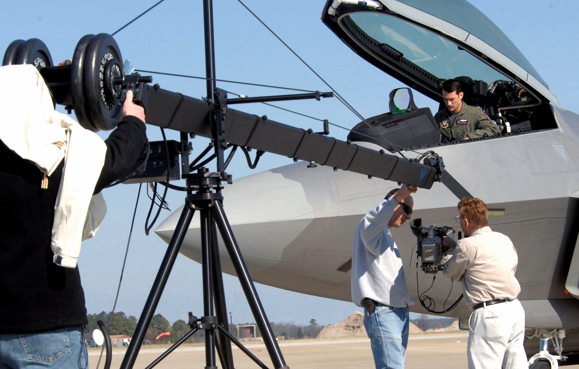 The Discovery Military Channel films an episode March 11 at Langley Air Force Base, Va. The episode, which is part of the series "Showdown: Air Combat," will focus on the F-22 Raptor and its capabilities. Maj. Paul Moga, an F-22 demonstration team pilot, will host the series, which is scheduled to premiere in June and will highlight different military aircraft. (U.S. Air Force photo/Senior Airman Cecil C. McCloud) 
