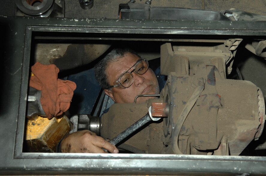 Dennis Flores, 355th Logistics Readiness Squadron vehicle maintenance, removes a jack-shaft on an MB-4 truck here March 13. (U.S. Air Force photo by Airman 1st Class Noah R. Johnson)