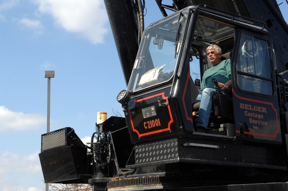 WHITEMAN AIR FORCE BASE, Mo. -Joel Harmon, contractor, operates this 210 ton crane to install a large air conditioning unit Mar. 14. Mr. Harmon hoisted the avionic simulator cooling unit into place with the 200-foot tall crane with no difficulties. (U.S. Air Force photo/Staff Sgt Charles D. Larkin Sr.)  