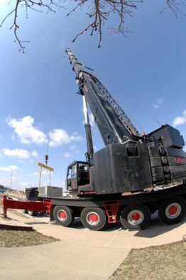 WHITEMAN AIR FORCE BASE, Mo. -Members of the 509th Civil Engineer Squadron acquire a 200 foot tall crane to safely install a 275 ton air conditioning unit Mar. 14. The 509th CES hoisted the avionic simulator cooling unit into place without a hitch. (U.S. Air Force photo/Staff Sgt Charles D. Larkin Sr.)  