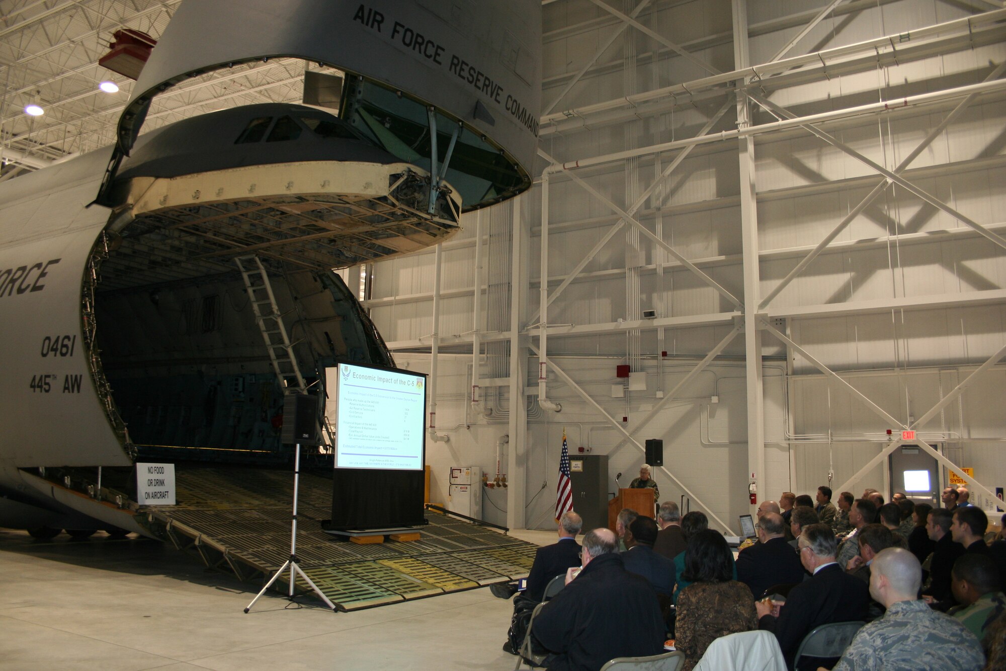 WRIGHT-PATTERSON AFB, Ohio - The 445th Maintenance Group Commander Col. Anna Schulte hosted the Logistics Officer Association meeting inside the new C-5 Fuel System Maintenance Hangar March, 14, 2008.  The open C-5 provided a crowd pleasing backdrop for the meeting.  The meeting's slideshow was projected inside the aircraft.  Aircrew was available to answer questions before the meeting began. (U.S. Air Force photo/Mary Allen)