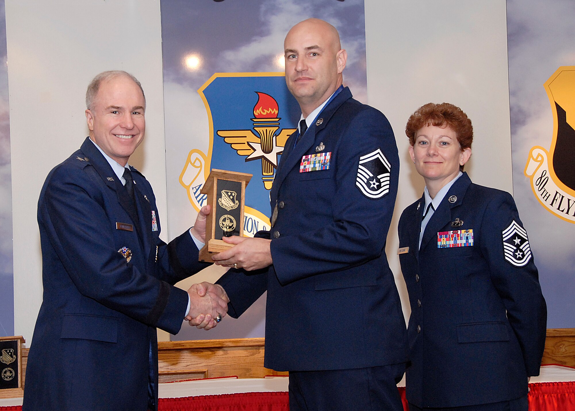 Brig. Gen. Richard Devereaux, 82nd Training Wing commander, presents Senior Master Sgt. James Pritchard, 364th Training Squadron, the Senior NCO Instructor of the Year award March 14 at the Annual Tech Training Awards. (U.S. Air Force photo/Harry Tonemah)