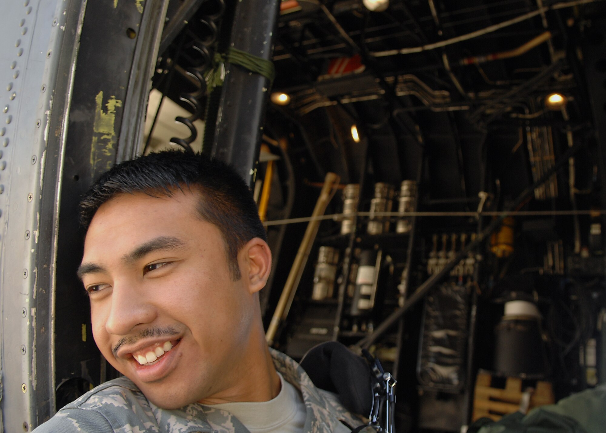MOODY AIR FORCE BASE, Ga. --  Airman 1st Class Philip Yago, 723rd Aircraft Maintenance Squadron HC-130P crew chief, takes a quick break from working in the sun here March 12. Airman Yago has been working maintenance on the HC-130P aircraft in support of exercise Flying Tiger 08-03. (U.S. Air Force photo by Airman 1st Class Brittany Barker)