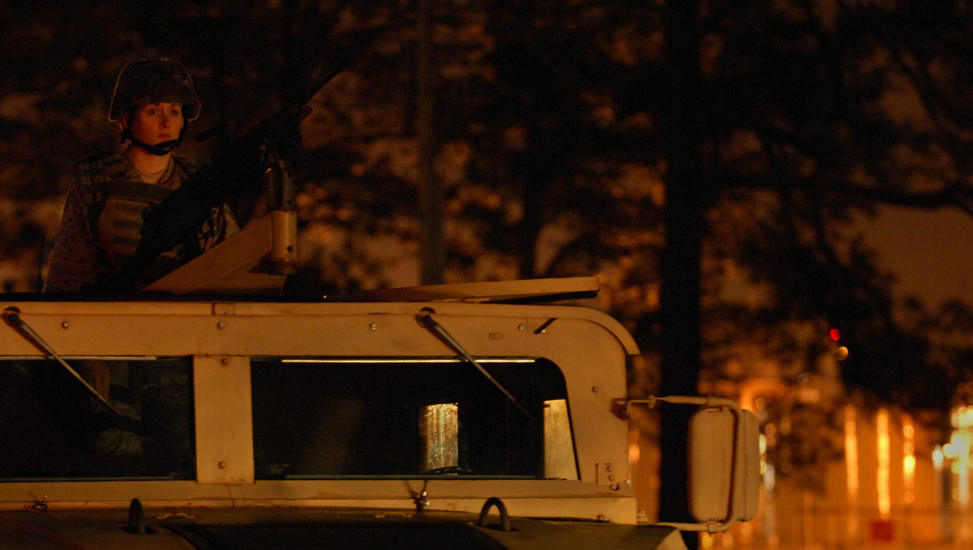 MOODY AIR FORCE BASE, Ga. -- Airman 1st Class Peggy Arms, 23rd Security Forces member, mans the turret of a humvee here March 11. Airman Arms performed the main gate over watch as well as many other posts during exercise Flying Tiger 08-03. (U.S. Air Force photo by Senior Airman Elizabeth Rissmiller) 