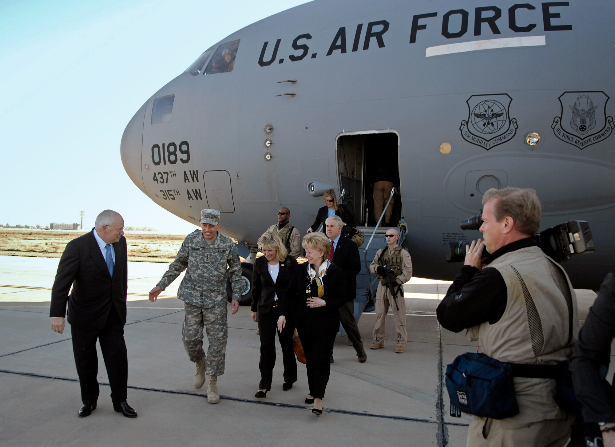 Vice President Dick Cheney talks with Army Gen. David Petraeus upon disembarking a C-17 Globemaster III March 17 at Sather Air Base, Iraq. The C-17 is based out of Charleston Air Force Base, S.C. General Petraeus is the commanding general of the Multi-National Force - Iraq. (U.S. Air Force photo/Tech. Sgt. Jeffrey Allen) 
