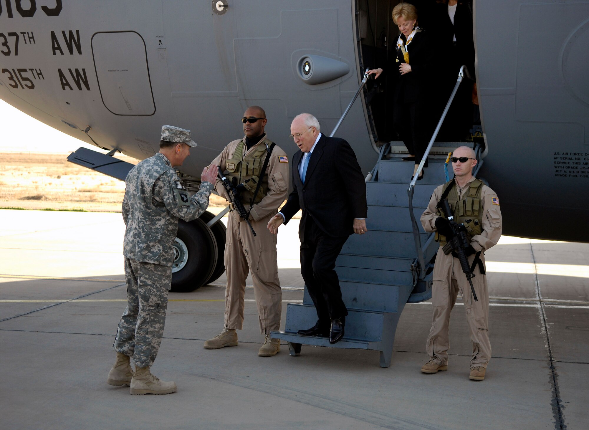 Vice President Dick Cheney is greeted by Army Gen. David Petraeus as he steps off an Air Force C-17 Globemaster III March 17 at Sather Air Base, Iraq. The C-17 is based out of Charleston Air Force Base, S.C. General Petraeus is the commanding general of the Multi-National Force - Iraq. (U.S. Air Force photo/Tech. Sgt. Jeffrey Allen) 
