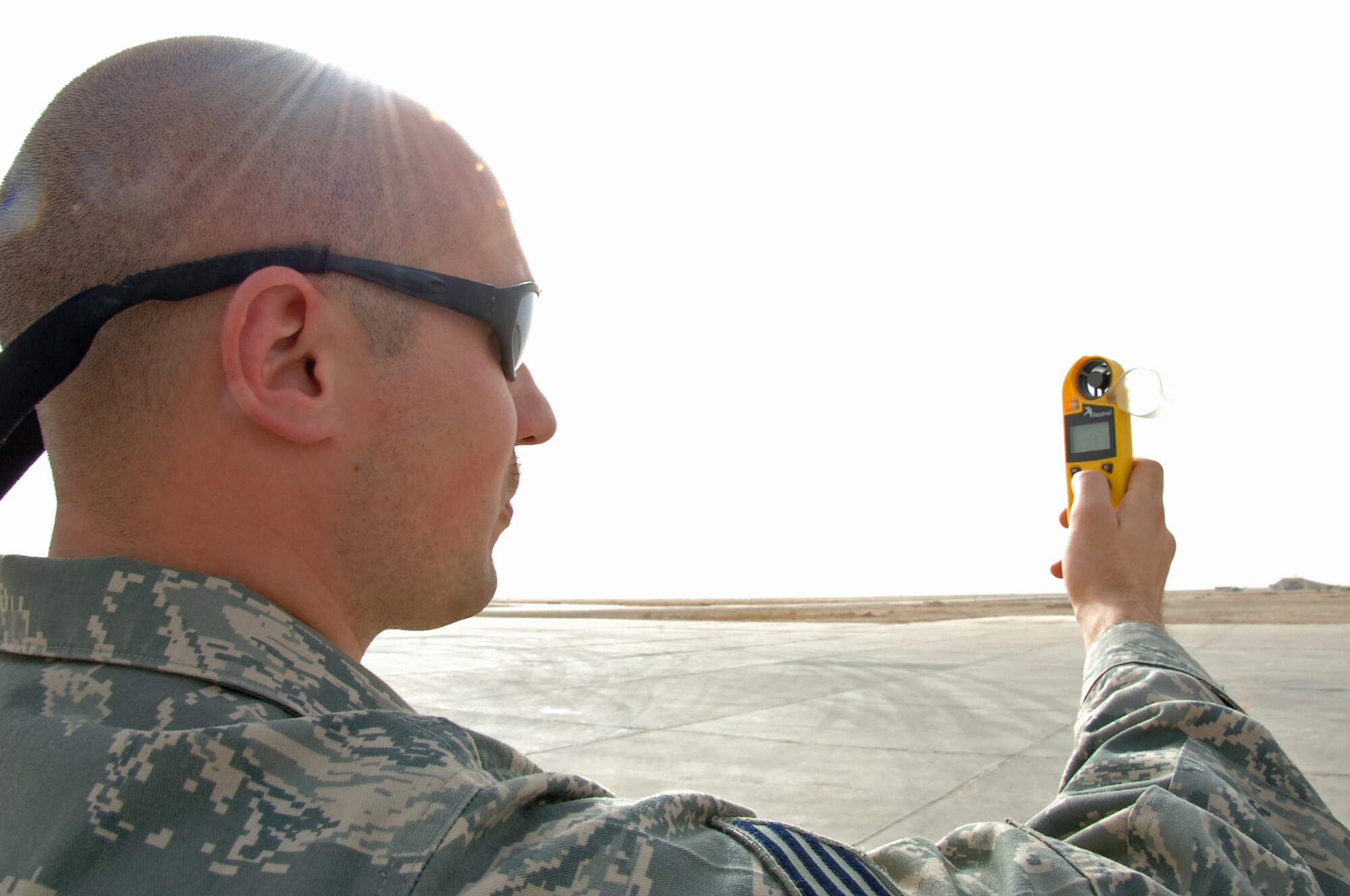 ALI BASE, Iraq ? Staff Sgt. Brandon Healy of the 407th Expeditionary Operations Support Squadron, demonstrates the backup weather support capability by using a handheld Kestrel March 17.  Sergeant Healy is deployed from McGuire AFB, NJ. (U. S. Air Force photo / Tech. Sgt. Sabrina Johnson)(Released)