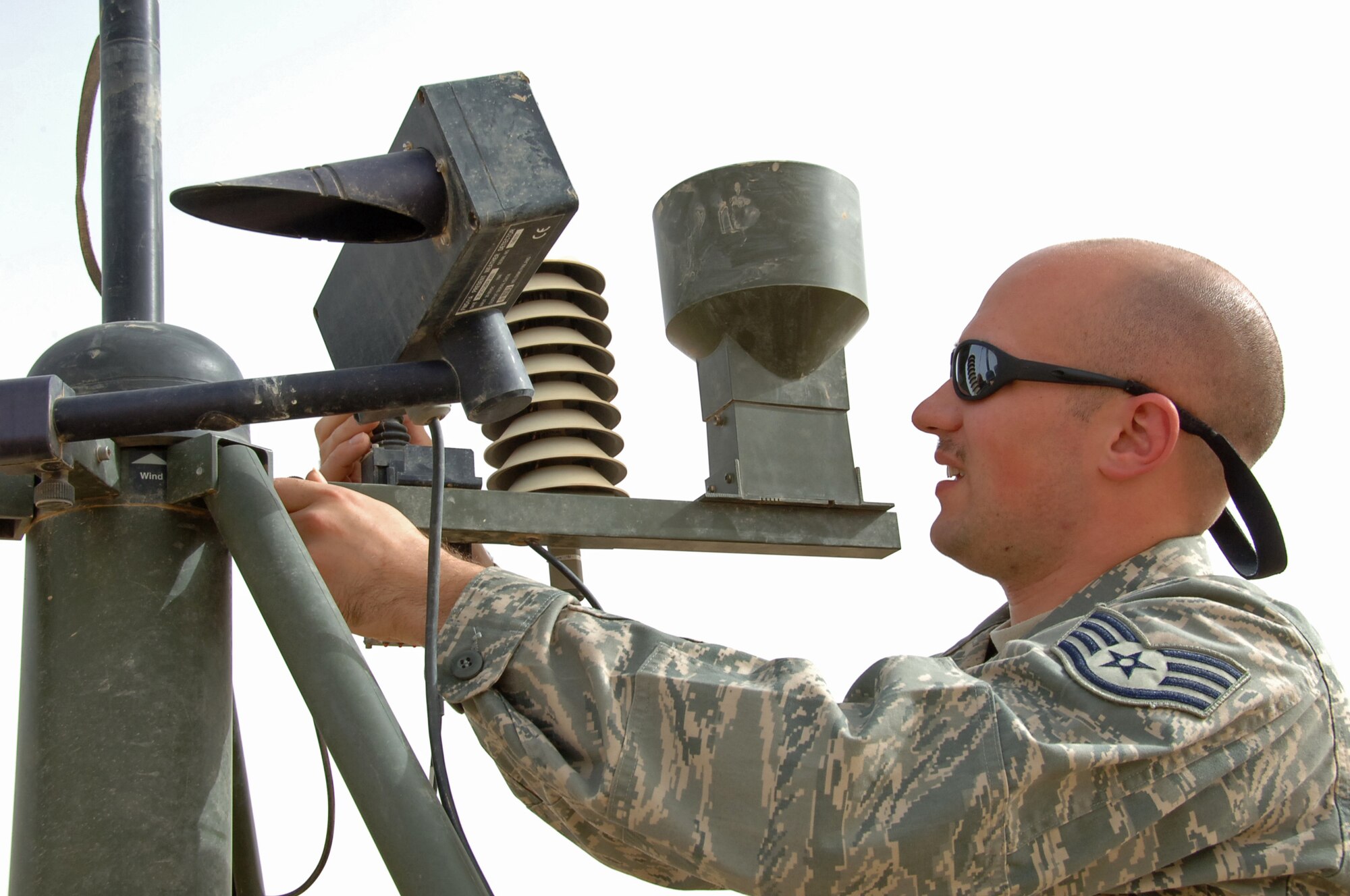 ALI BASE, Iraq ? Staff Sgt. Brandon Healy of the 407th Expeditionary Operations Support Squadron, performs preventive maintenance on a TMQ-53, tactical weather sensor package March 17.  Sergeant Healy is deployed from McGuire AFB, NJ.   (U. S. Air Force photo / Tech. Sgt. Sabrina Johnson)(Released)