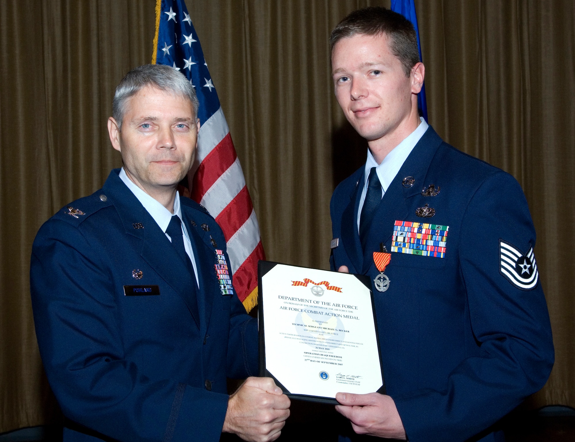 Col. Eric Pohland, 96th Air Base Wing commander, pins a Combat Action Medal on Tech Sgt. Michael Becker, 96th Civil Engineer Squadron's Explosive Ordnance Disposal Flight. In May, 2005, Sergeant Becker was in a convoy in Iraq when a it was hit by a suicide improvised explosive device that blew up vehicle behind his. Two soldiers were badly burned, and Sergeant Becker and his team secured the site, and performed combat life saving actions and transported the wounded to a forward operating base.  His team also performed the post blast investigation. The award is for Airmen who have been involved in direct fighting situations where they risked their lives in an enemy engagement. 