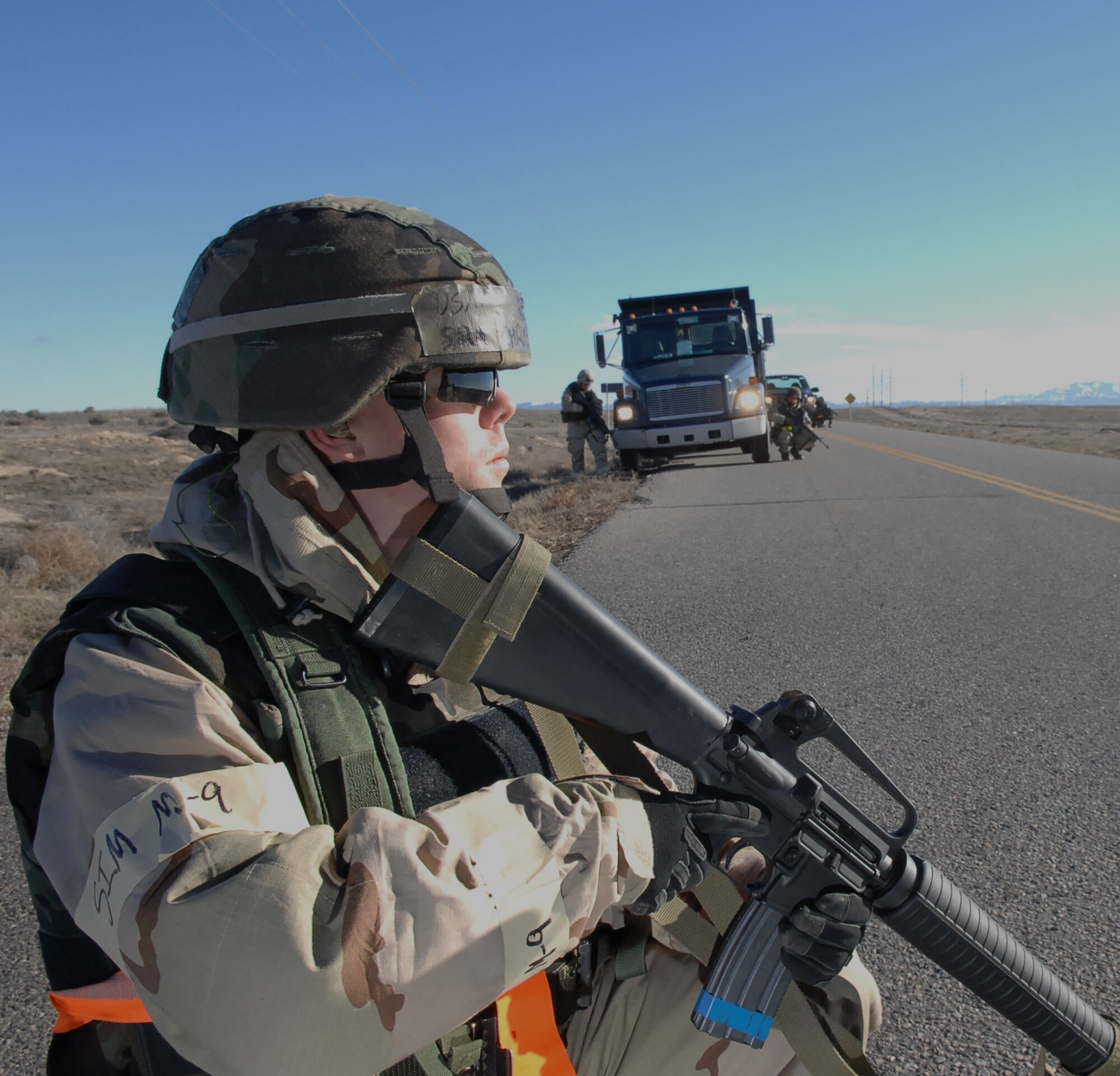 MOUNTAIN HOME AIR FORCE BASE, Idaho -- Senior Airman Christopher Williams, 366th Logistics Readiness Squadron supply specialist, provides security during a convoy at a simulated deployed location during Exercise Coronet White 08-ACC-14 March 16. The 366th Fighter Wing is participating in an Operational Readiness Inspection March 13-21 to test the wing's ability to deploy and take its mission to war. (U.S. Air Force photo by Staff Sgt. Kathy Parker)