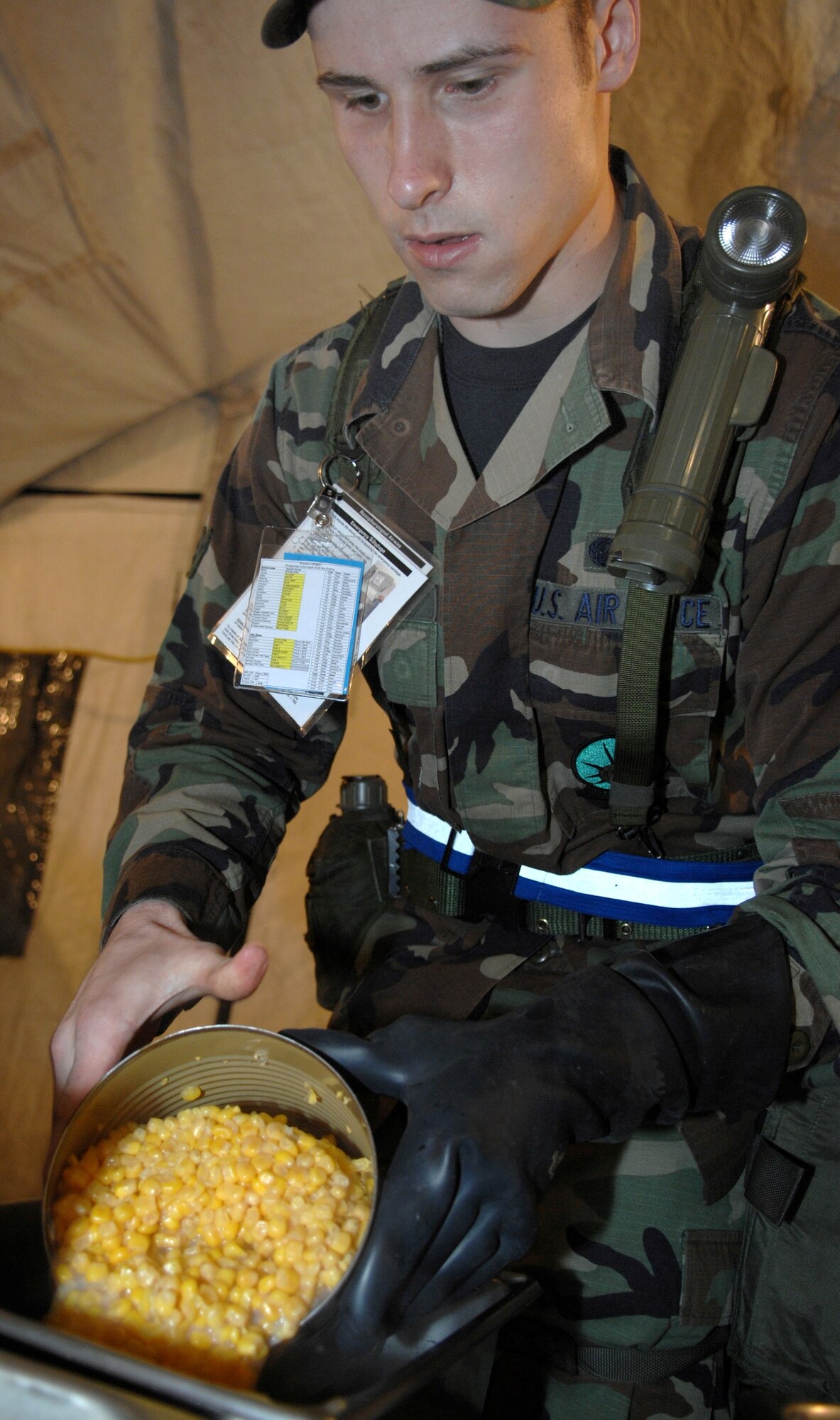 MOUNTAIN HOME AIR FORCE BASE, Idaho -- Airman Nickolas Williams, 366th Services Squadron food service specialist, prepares utilized group rations meals for Airmen during Exercise Coronet White 08-ACC-14 March 16. The 366th Fighter Wing is participating in an Operational Readiness Inspection March 13-21 to test the wing's ability to deploy and take its mission to war. (U.S. Air Force photo by Airman 1st Class Stephany Miller)