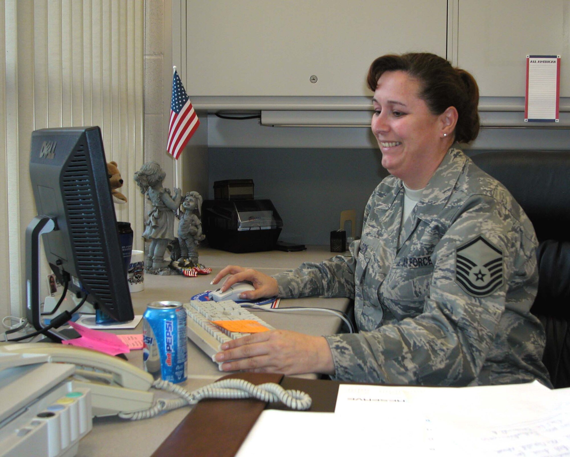 Master Sgt. Debra Nelson, noncommissioned officer in charge of the 940th Air Refueling Wing Airman and Family Readiness office, Beale Air Force Base, Calif., works at her computer. A traditional Reservist, Sergeant Nelson has been with the wing for more than 10 years. (U.S. Air Force photo/Staff Sgt. Luke D. Johnson)  