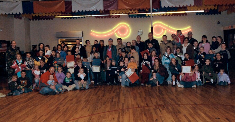 FAIRCHILD AIR FORCE BASE, Wash. – Children of military members pose with acting commander Col. Roger Watkins, 92nd Air Refueling Wing, to show off their certificates of completion after the Kids Understanding Deployment Operations event here March 15. This three-phase event allowed children of military members to focus on the aspects of pre-deployment, deployment and post-deployment operations. (U.S. Air Force photo/Airman 1st Class Darlene West)