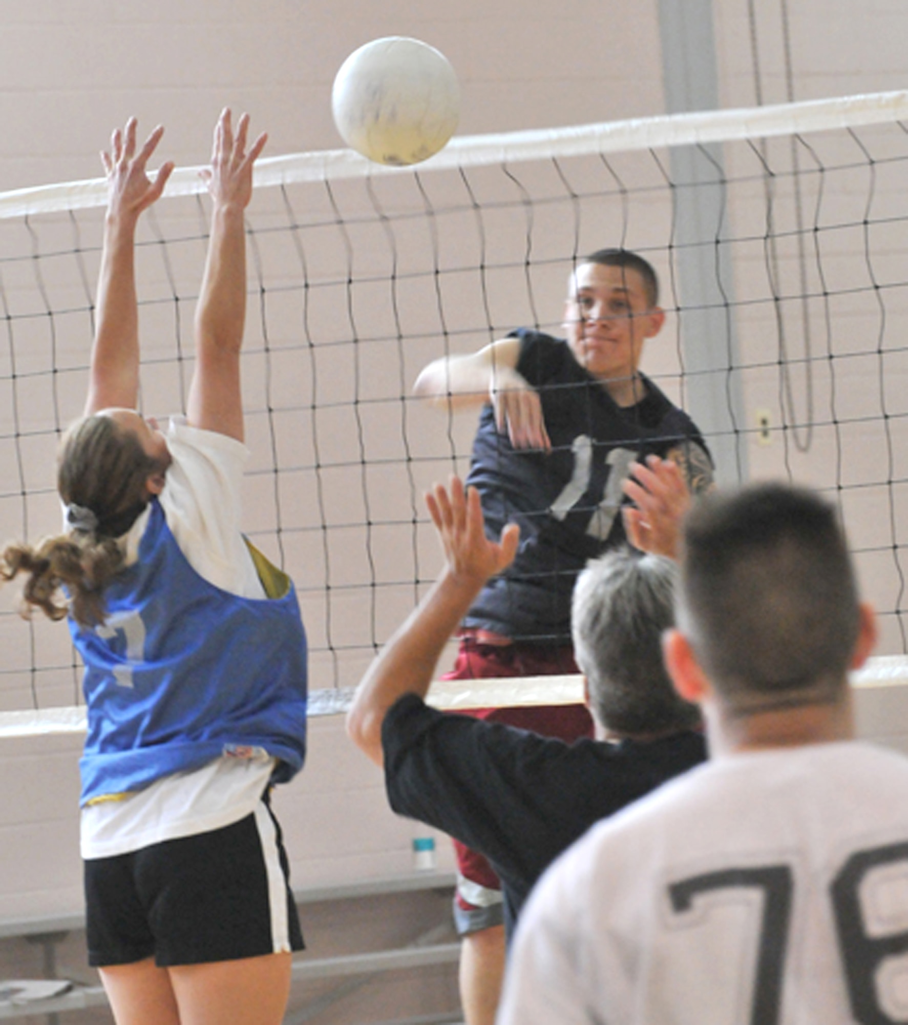 21st Space Communications Squadron’s Justin Lord rifles a shot past Air Force Space Command defenders during a scrimmage March 13 at the Peterson Fitness and Sports Center. (U.S. Air Force photo/Walt Johnson)