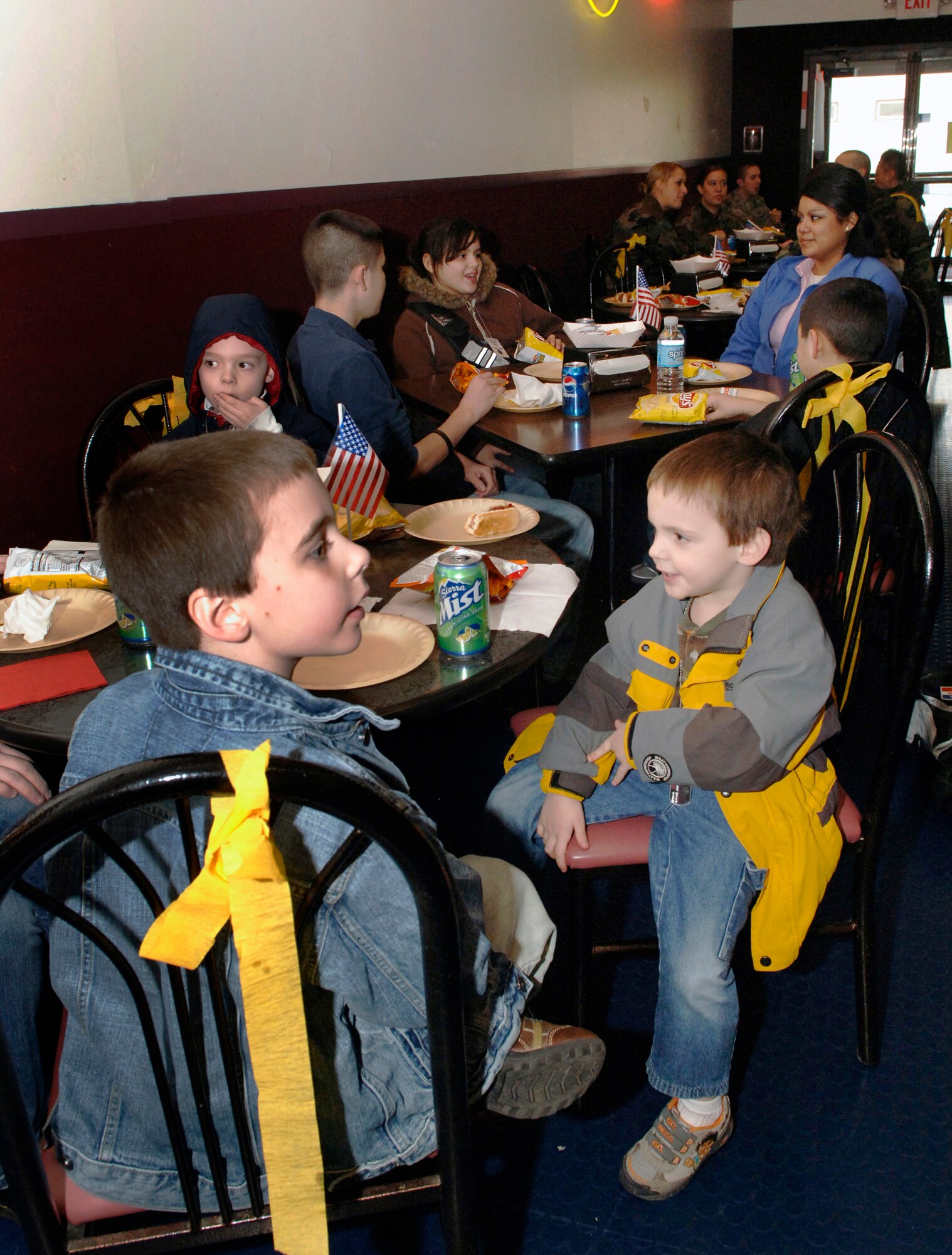 FAIRCHILD AIR FORCE BASE, Wash. – Children gather for hot dogs during the third phase of the Kids Understanding Deployment Operations event here March 15. KUDOS is a three-phase event allowing children of military members to focus on the aspects of pre-deployment, deployment and post-deployment operations. (U.S. Air Force photo/Airman 1st Class Darlene West)