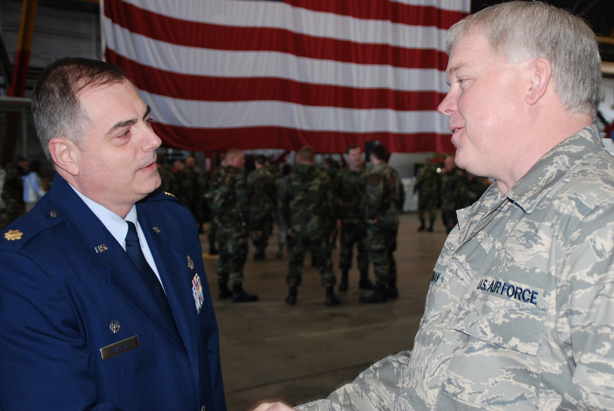 Maj. Clifford Waller, the 932nd Maintenance Squadron's new commander, greets Command Chief Master Sgt. Merle Lyman, 932nd Airlift Wing.  Major Waller assumed command at the March unit training assembly.  Photo/Tech. Sgt. Dan Oliver