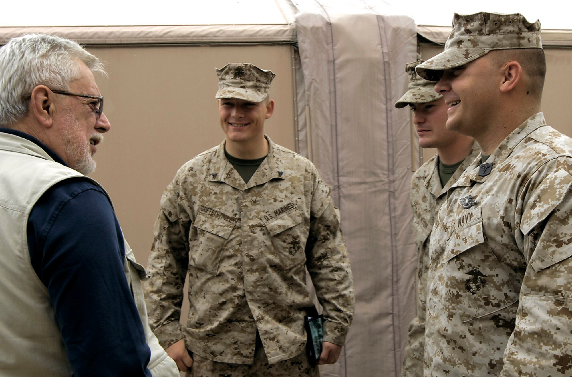 Medal of Honor recipient retired Marine Capt. John J. McGinty III visits with Marines March 15 at Manas Air Base, Kyrgyzstan. Captain McGinty received his medal from actions taken during the Vietnam War. (U.S. Air Force/Senior Airman Tabitha Kuykendall) 