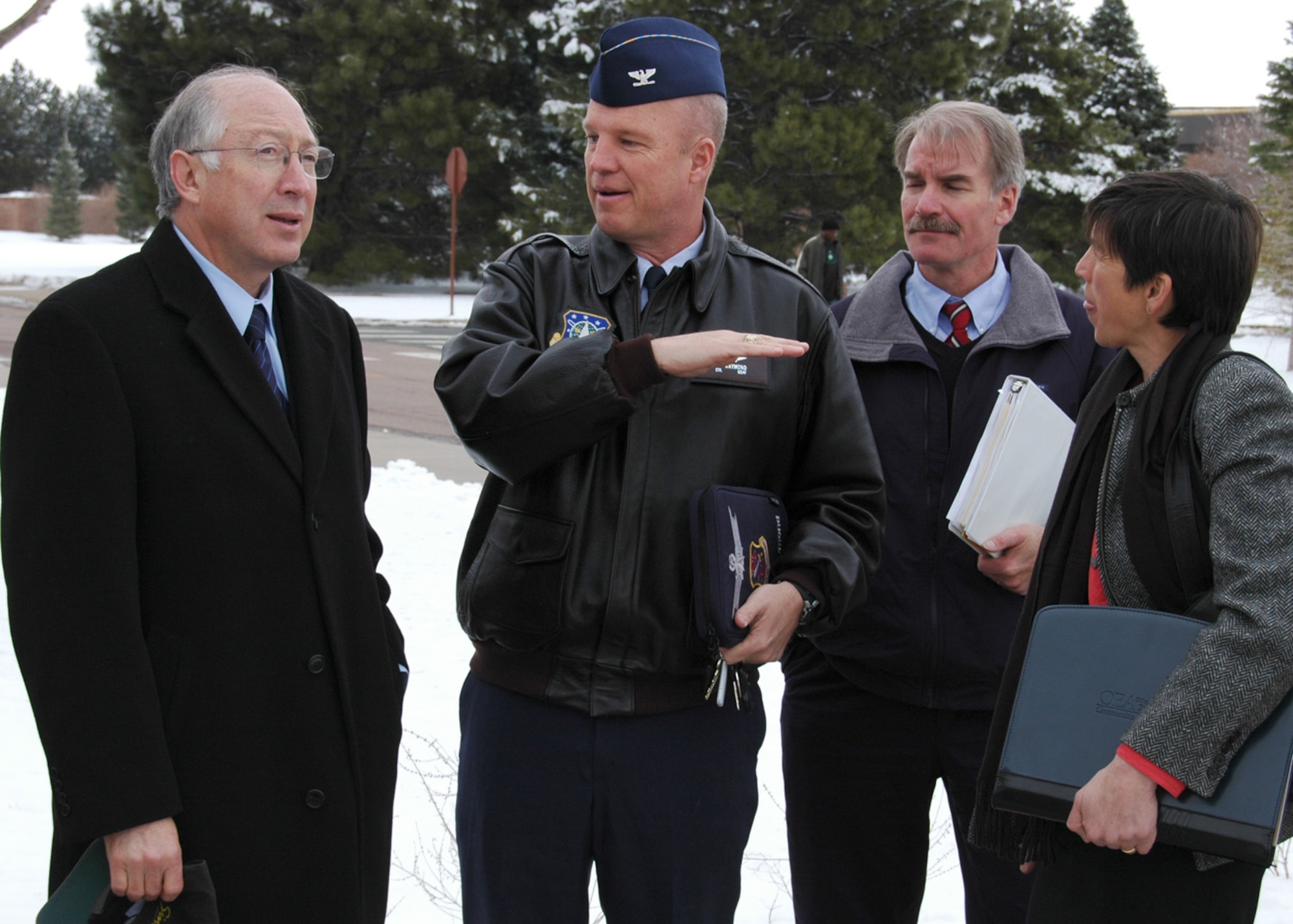 U.S. Senator Salazar listens as Col. Jay Raymond, 21st Space Wing commander tells him about an eco-friendly "green roof" on building 845 during his visit to Peterson Air Force Base, Colo., March 17. The senator toured the base during his visit and learned about other efforts Peterson is making to become more environmentally friendly, Peterson’s Blueprint 2050 program that addresses base encroachment and other military issues during his visit. (U.S. Air Force photo/Steve Brady)