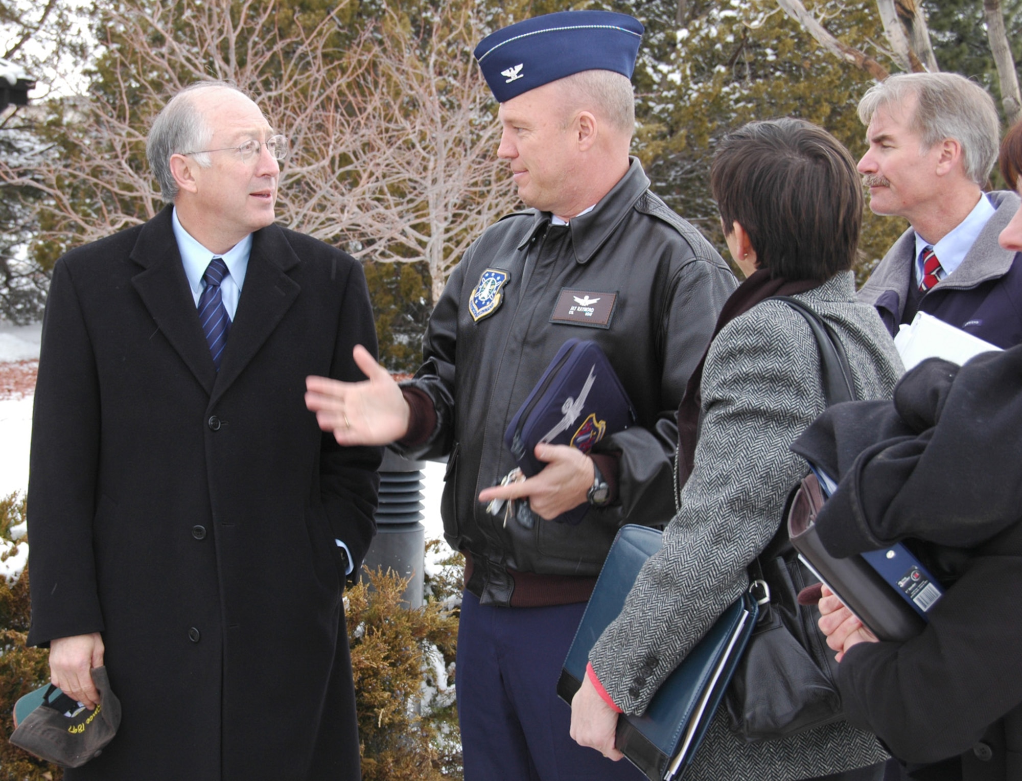 U.S. Senator Salazar listens as Col. Jay Raymond, 21st Space Wing commander tells him about an eco-friendly "green roof" on building 845 during his visit to Peterson Air Force Base, Colo., March 17. The senator toured the base during his visit and learned about other efforts Peterson is making to become more environmentally friendly, Peterson’s Blueprint 2050 program that addresses base encroachment and other military issues during his visit. (U.S. Air Force photo/Steve Brady)
