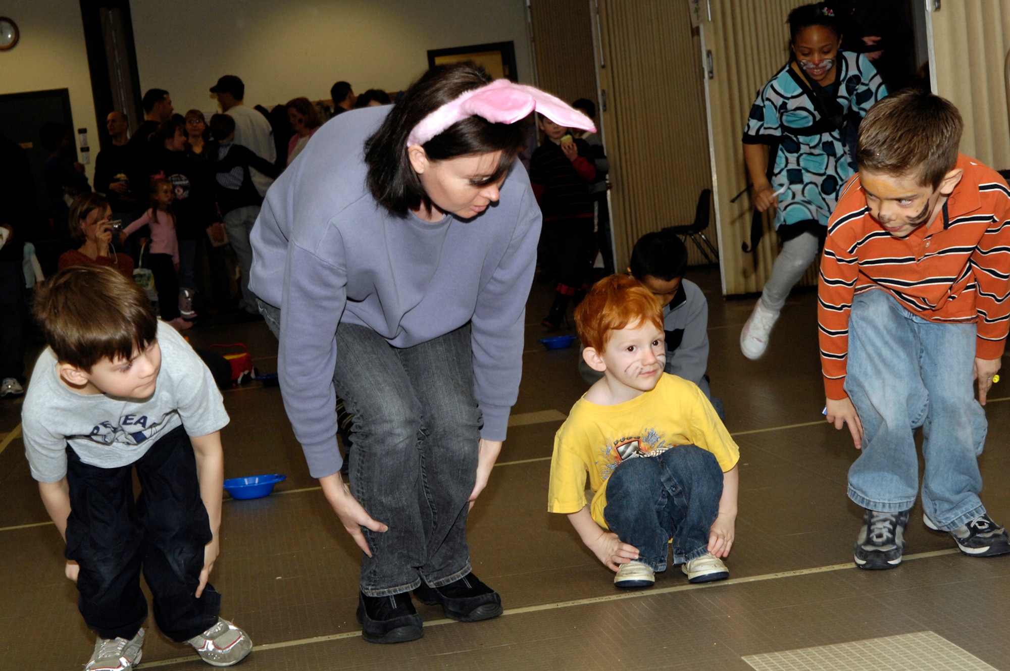 HANSCOM AFB, Mass. – Attendees to the Spring Fling event on March 15 at the Base Chapel participate in a bunny hop contest. The event included face painting, games, crafts, refreshments and an egg hunt. The Spring Fling was sponsored by the Hanscom Spouses’ Club, Base Chapel, American Eagle and the Parent Teacher Organization. (U.S. Air Force photo by Mark Wyatt)