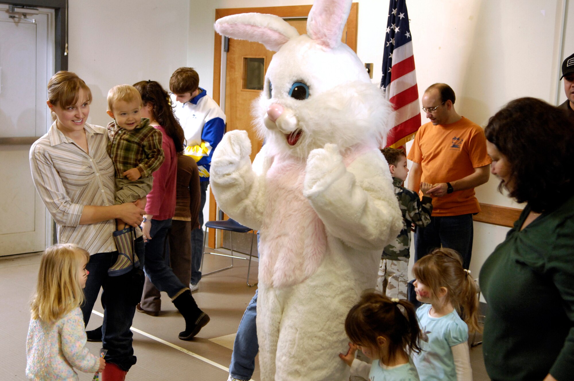 HANSCOM AFB, Mass. – Hanscom children enjoy a moment with the Easter Bunny on March 15 during the Spring Fling event at the Base Chapel. The event included face painting, games, crafts, refreshments and an egg hunt. The Spring Fling was sponsored by the Hanscom Spouses’ Club, Base Chapel, American Eagle and the Parent Teacher Organization. (U.S. Air Force photo by Mark Wyatt)