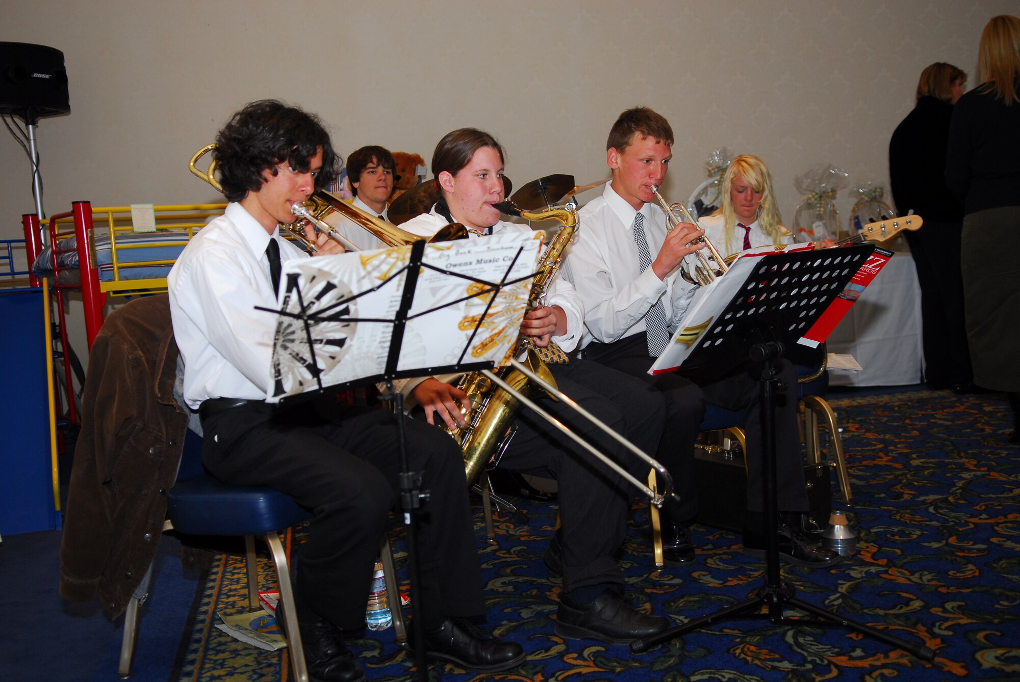 VANDENBERG AIR FORCE BASE, Calif. -- The Cabrillo high school jazz ensemble performed scores of jazz music during the Spouses Club charity auction Mar 15. An amount of 75 percent of the money goes toward a dependent scholarship fund, the remaining 25 percent is disseminated to local charities and deployed Airmen care packages. The event raised over $27,000. (U.S. Air Force photo/Senior Airman Ashley Hawkins)