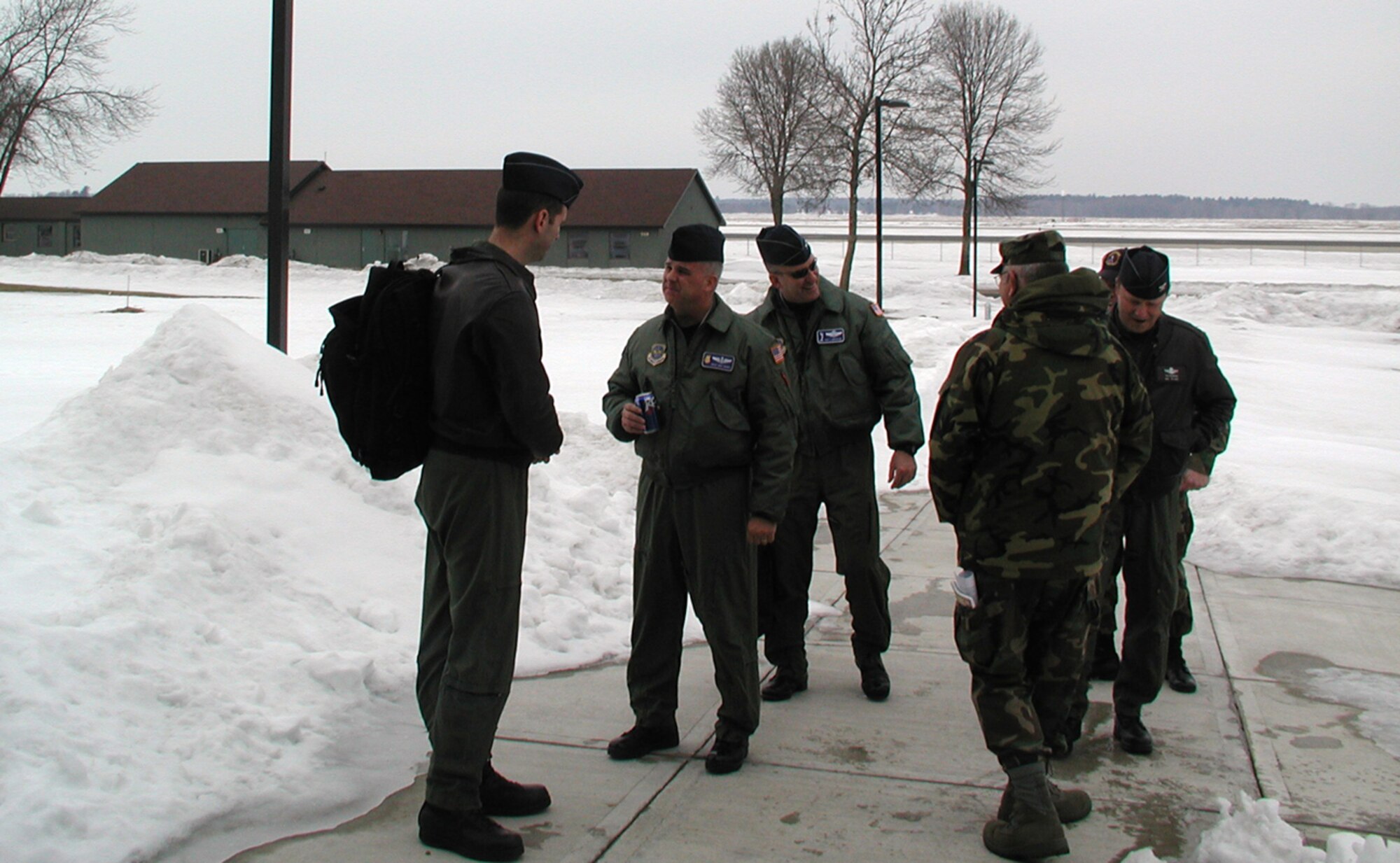 080312-F-1623F-006
Members of a site survey team talk between the snow banks and in the cold of Volk Field Air National Guard Base, Wis.  Personnel from the 931st Air Refueling Group and the 22nd Air Refueling Wing travelled from McConnell Air Force Base, Kan., to Volk Field on March 12 to see the location of an upcoming exercise and inspection.