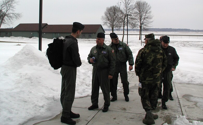 080312-F-1623F-006
Members of a site survey team talk between the snow banks and in the cold of Volk Field Air National Guard Base, Wis.  Personnel from the 931st Air Refueling Group and the 22nd Air Refueling Wing travelled from McConnell Air Force Base, Kan., to Volk Field on March 12 to see the location of an upcoming exercise and inspection.