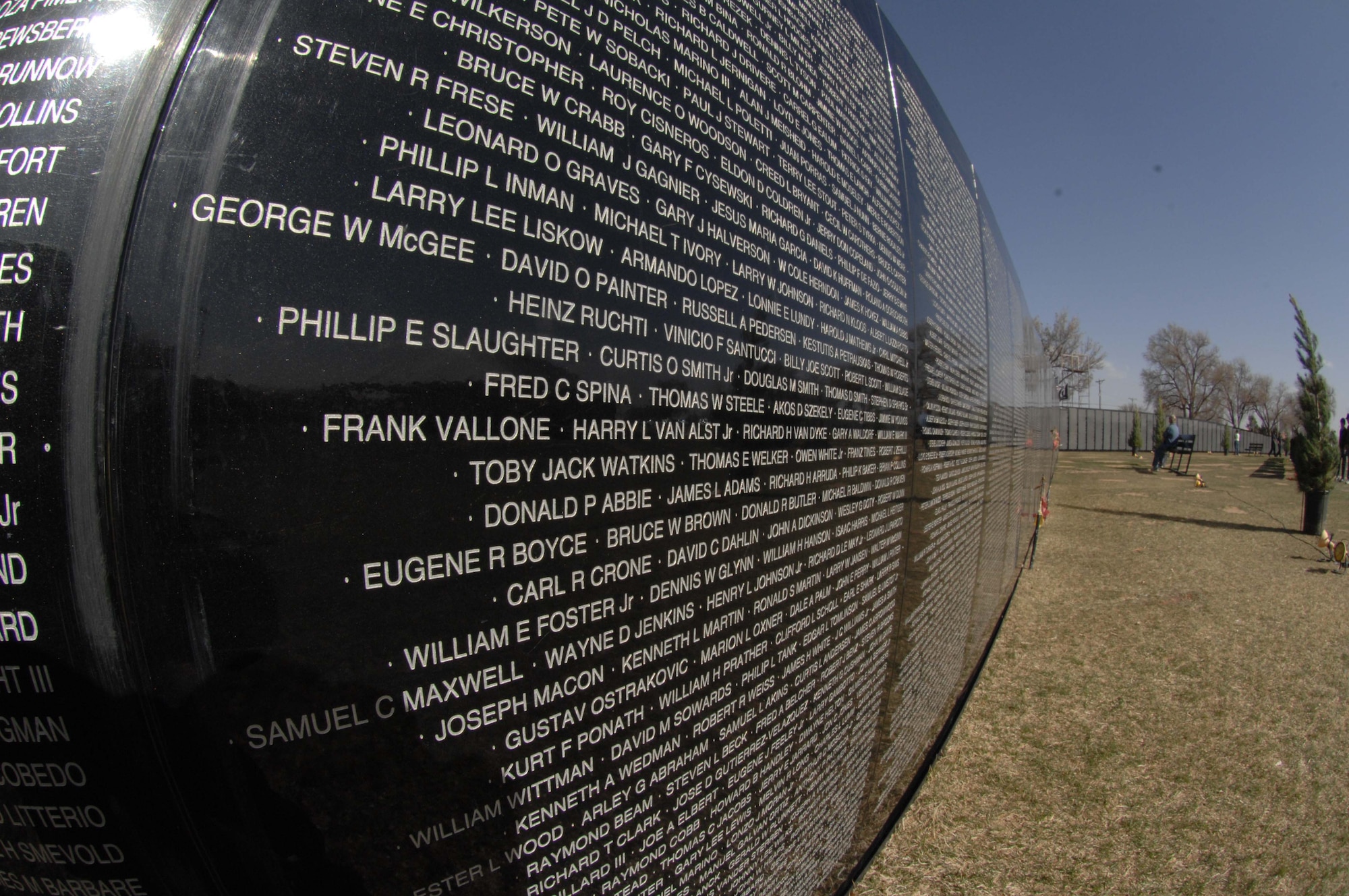 CANNON AIR FORCE BASE, N.M. - Names of deceased servicemembers extend into the distance on the Traveling Wall, an 80 percent replica of the Vietnam Memorial. The wall is one exhibit of the American Veterans Traveling Tribute, which stopped in nearby Clovis, N.M., March 13 - 19. (U.S. Air Force photo by Airman 1st Class Evelyn Chavez)