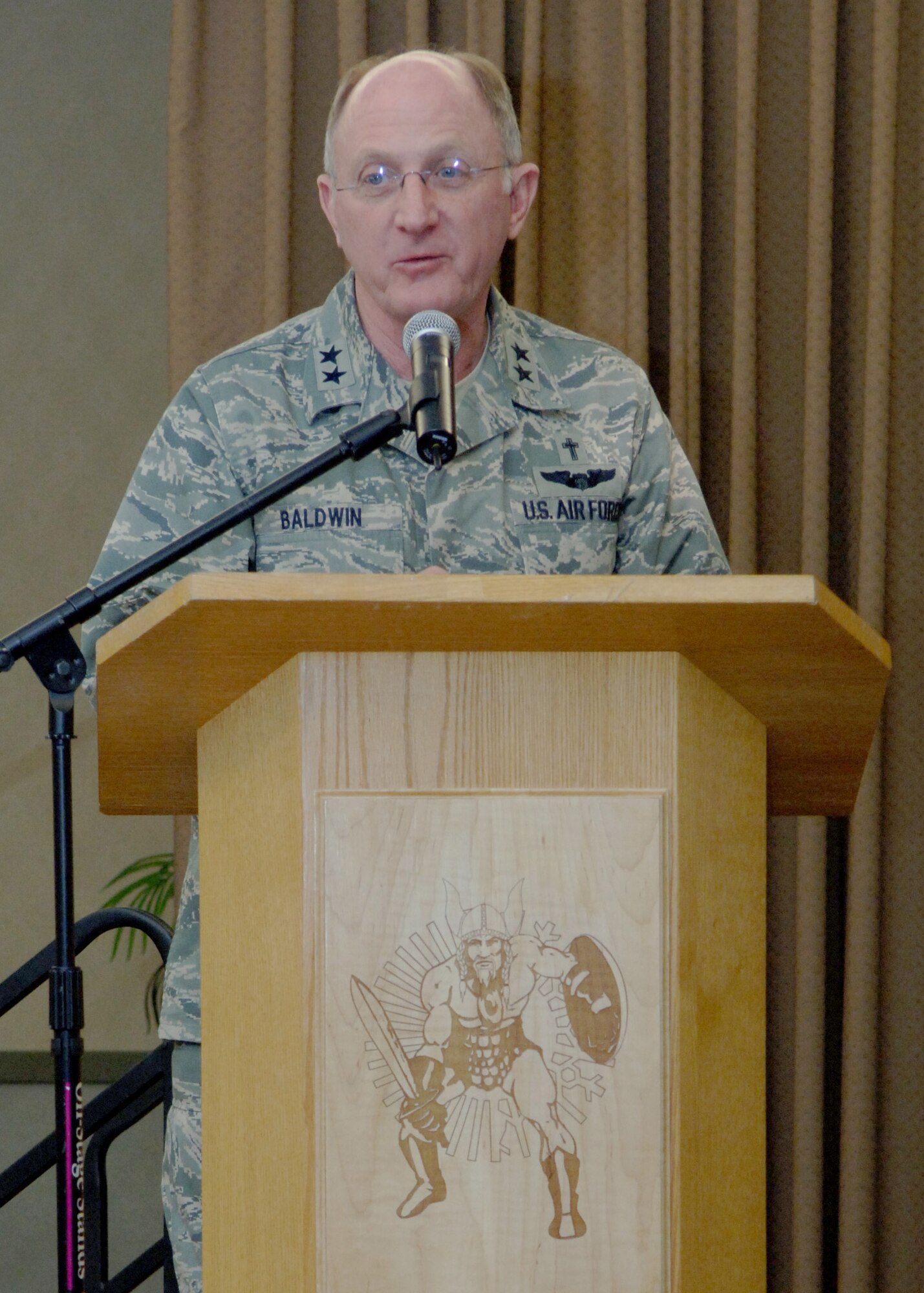 Chaplain, Maj. Gen. Charles C. Baldwin, Air Force Chief of Chaplains, speaks to members of the base during the National Prayer Luncheon March 13. The luncheon featured a keynote address on ?iPrayer? designed to communicate religious messages through contemporary metaphors. (U.S. Air Force photo by Senior Airman Tiffany Colburn).  