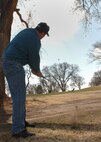 CANNON AIR FORCE BASE N.M. - Kenneth Sherrod, 27th Special Operations Aeromedical Dental Squadron, drives a golf ball to the hole at Whispering Winds Golf Course.  Mr. Sherrod was a part of the second place team.  (U.S. Air Force photo by Airman 1st Class James R. Bell)