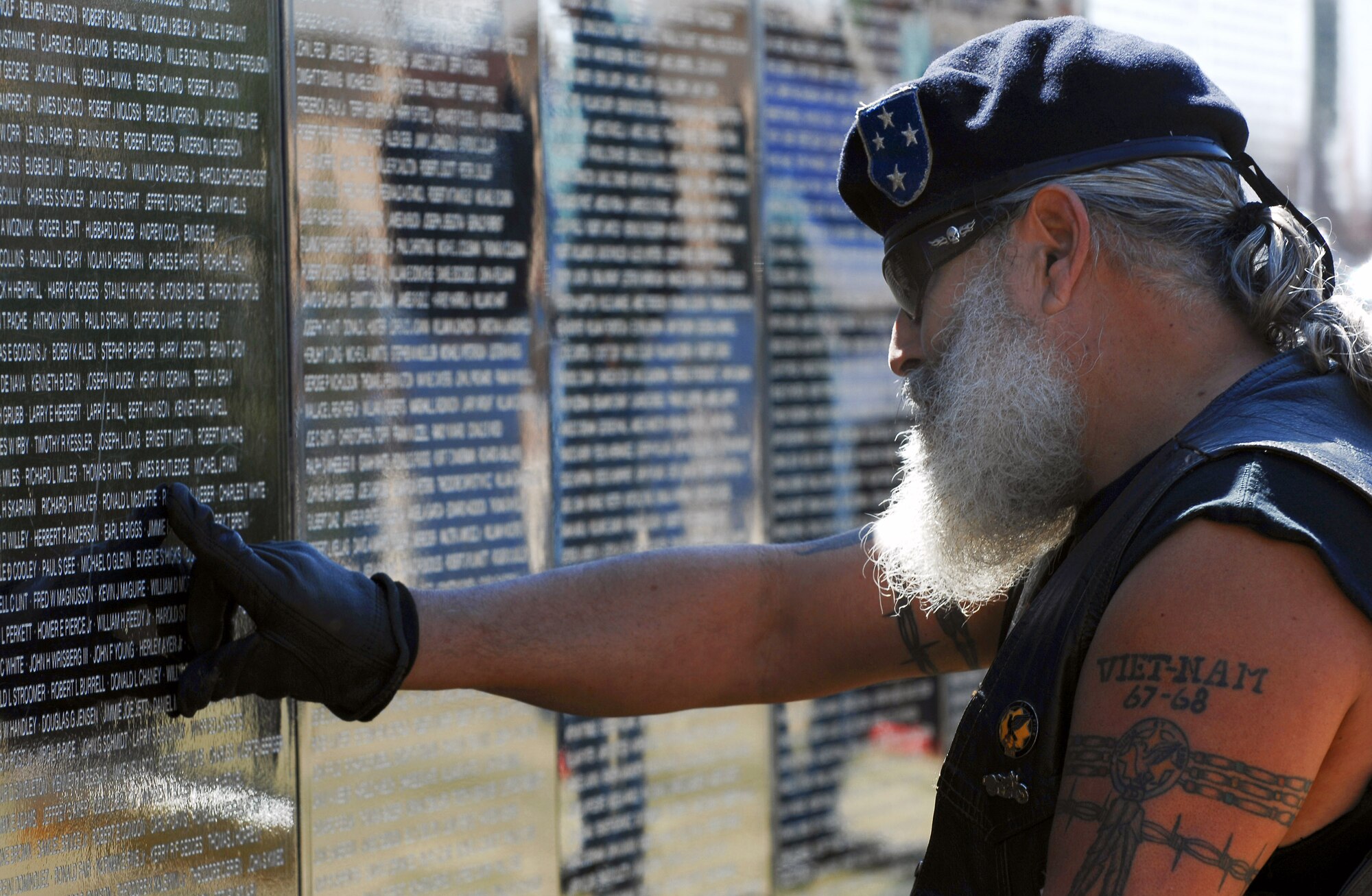 Veteran Rudy Garcia stops at a spot on the traveling Vietnam Wall in Clovis, N.M., March 15 to remember and honor the memories of his friends who gave their lives during the Vietnam War.  The Wall is transported around the country to give people who otherwise may not be able to make the trip to Washington D.C. the opportunity see the Wall in their home town and pay their respects.  The Wall was on display in Clovis, home of Cannon Air Force Base, from March 14 to 18.  (U.S. Air Force photo/Airman 1st Class Liliana Moreno)