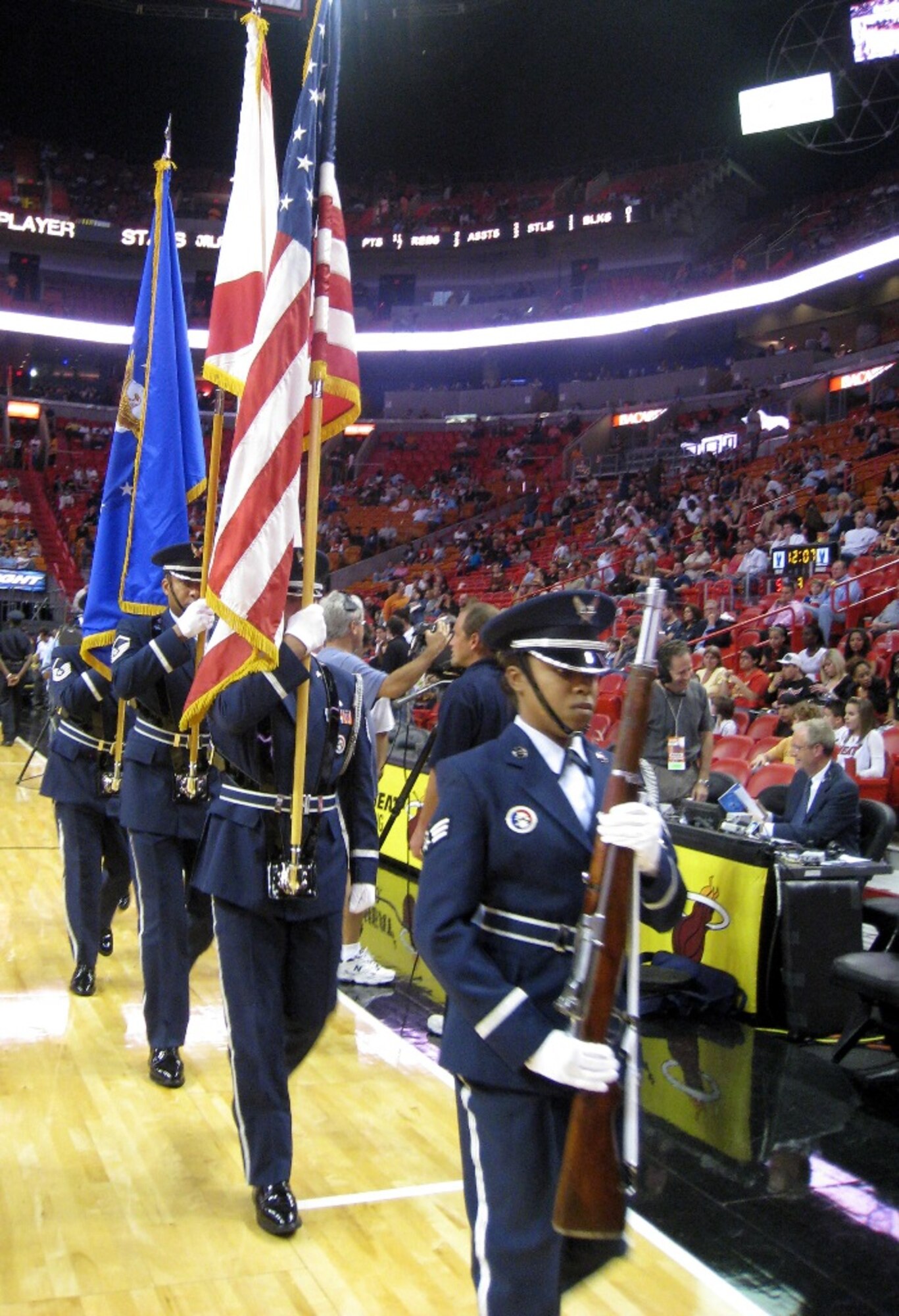 The 482nd Fighter Wing Honor Guard exits the court at American Airlines Arena after presenting the colors at the “Air Force Reserve Night” during the Miami Heat game on March 14. The first-ever event, spearheaded by the 482nd Fighter Wing’s Recruiting Office, also featured a mass enlistment during halftime, and reservists volunteering at four informational kiosks scattered around the arena to help raise awareness about the Reserve. (U.S. Air Force photo/Staff Sgt. Leo Castellano)