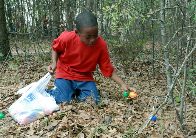 Gary Godley gathers some eggs during the Easter egg hunt at Youth Programs on base Saturday. Gary is the 11-year-old son of Tech. Sgt. David Feaster. (U.S. Air Force photo/Airman 1st Class Melissa White)