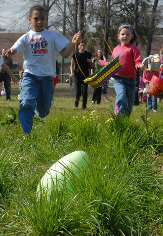 Children ages 6-8 take off running during an Easter egg hunt at Youth Programs on base Saturday.  Members of Youth Prgrams hid more than 6,000 eggs for four different age groups that day. (U.S. Air Force photo/Airman 1st Class Melissa White)
