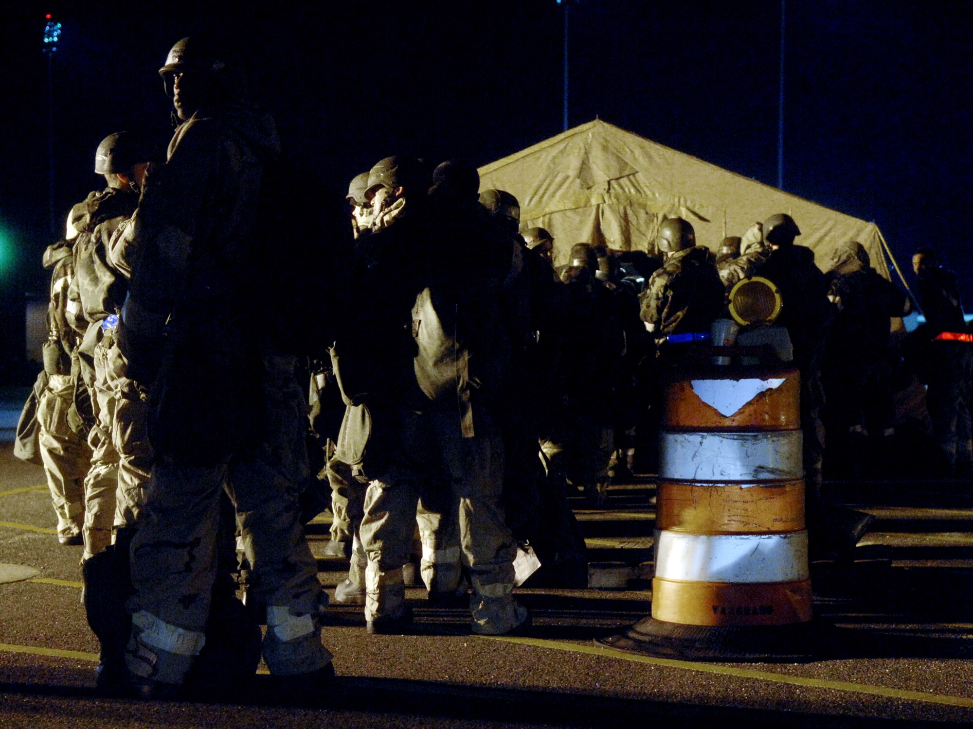 LANGLEY AIR FORCE BASE, Va. -- Airmen from the 1st Fighter Wing line up outside an entry control point before entering the training area of the Phase II Operational Readiness Exercise March 18. More than 1,000 Airmen are preparing for April’s Operational Readiness Inspection,which will test the Airmen’s ability to operate in a deployed environment. (U.S. Air Force photo/Senior Airman Vernon Young)