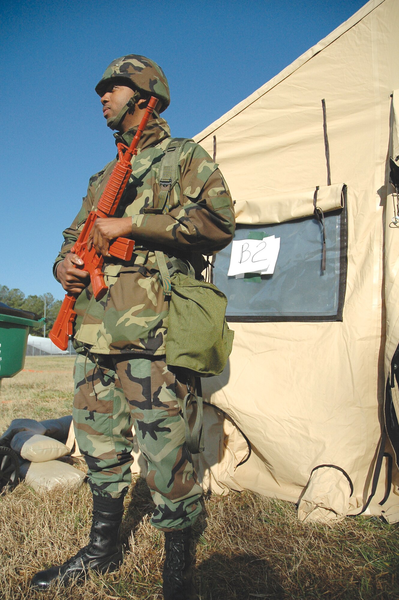 Staff Sgt. Rod Washington of the 94th Airlift Wing, stands sentry outside of tent B-2 in "Bravo Sector" of the "deployed" location used for a recent operational readiness exercise. The exercise gave Airmen an opportunity to put the Airman's Manual into practice and work together in a "deployed" environment.  