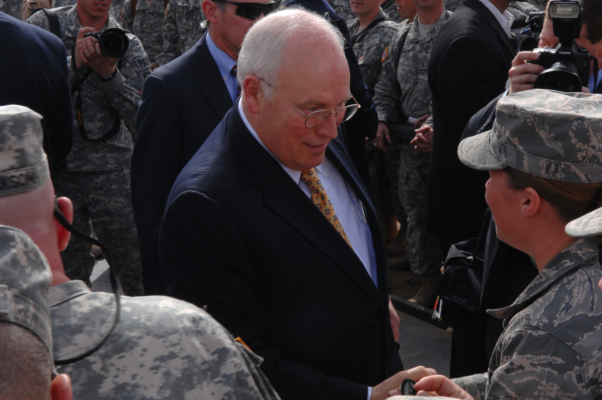 BALAD AIR BASE/ LOGISTICS SUPPORT AREA ANACONDA, Iraq -- U.S. Vice President Dick Cheney shakes the hands of uniformed servicemembers after a motivational speech here, March 18. The vice president came to the base to visit deployed military men and women serving in support of Operation Iraqi Freedom. (U.S. Air Force photo/ Senior Airman Julianne Showalter)