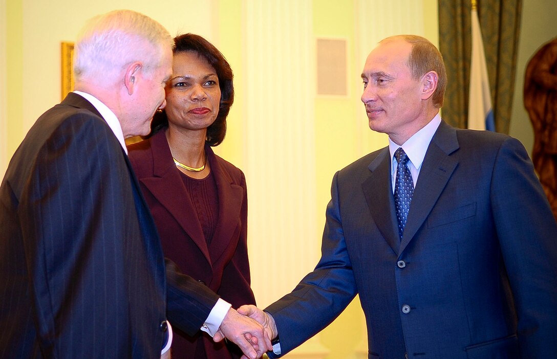 U.S. Defense Secretary Robert M. Gates meets Russian President Vladimir Putin as U.S.  Secretary of State Condoleezza Rice looks on at the Kremlin in Moscow, March 17, 2008. 
