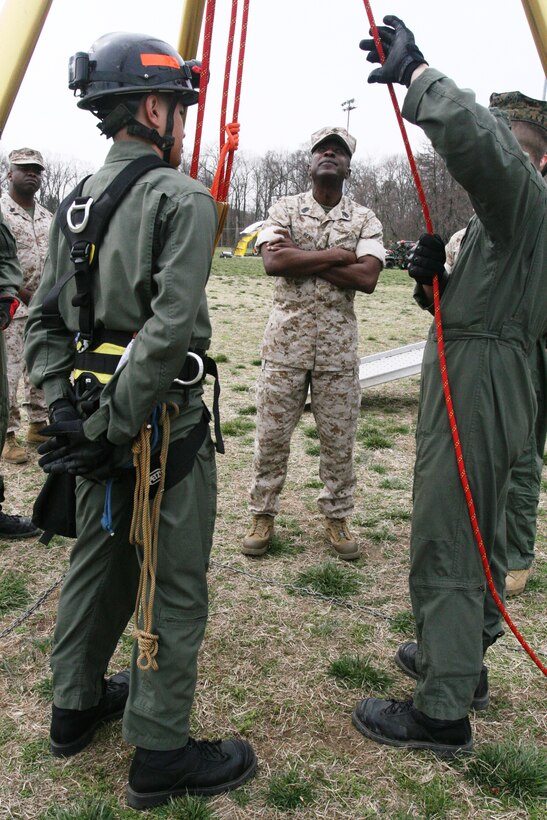 NAVAL SUPPORT FACILITY INDIAN HEAD, Md.? Marines and sailors of Chemical Biological Incident Response Force, II Marine Expeditionary Force, show Sgt. Maj. Carlton Kent, the 16th sergeant major of the Marine Corps, rope rescue techniques March 18. Kent spoke with the Marines and sailors on upcoming changes, such as the new combat fitness test, which is a new way of measuring a Marines combat fitness, and the Marine Corps? new physical fitness apparel.  (Official U.S. Marine Corps photo by Cpl. Leslie Palmer) (RELEASED)