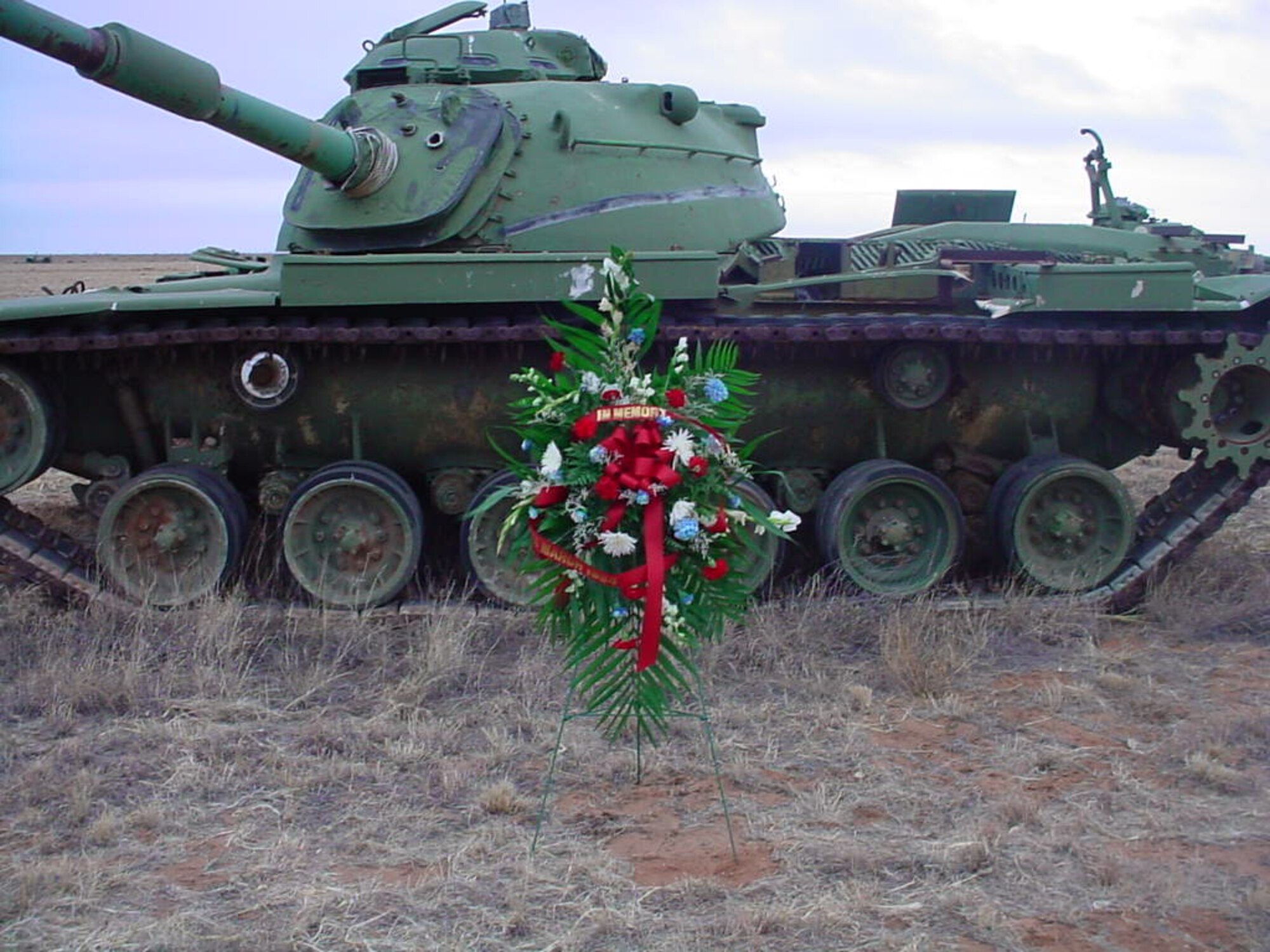 CANNON AIR FORCE BASE, N.M. - A wreath lays in front of a tank at the Melrose Bombing Range's Jockey 14 live-impact area. Jockey 14 was an AC-130H gunship which had an in-flight explosion March 4, 1994 over the coast of Kenya while in Somalia 14 years ago. Eight crewmembers were killed, while six survived. Jockey 14 was a 16th Special Operations Squadron, Hurlburt Field, Fla. asset. (courtesy photo)