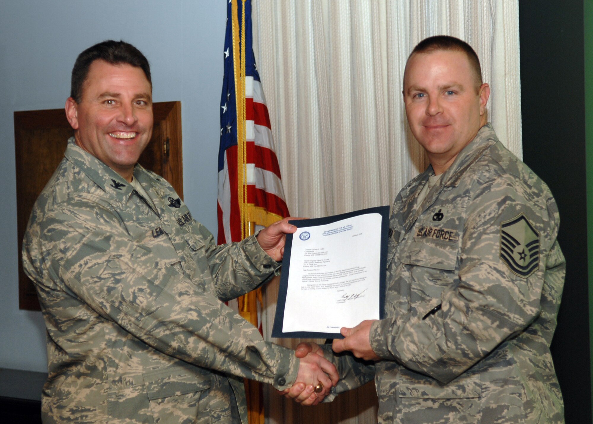 CANNON AIR FORCE BASE, N.M. - Master Sgt. Daniel Skurka, 27th Special Operations Logistic Readiness Squadron, receives the Traffic Management Senior Non Commissioned Officer of the Year award presented by Col. Timothy Leahy, 27th Special Operations Wing commander on March 18. (U.S. Air Force photo by Airman Basic Danielle Martin)