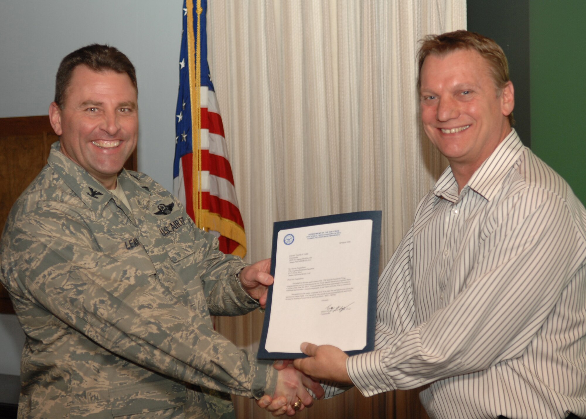 CANNON AIR FORCE BASE, N.M. - Mr. Steven Guastaferro, 27th Special Operations Logistic Readiness Squadron Installation Deployment Officer, receives the Logistics Plans Civilian of the Year award presented by Col. Timothy Leahy on March 18. (U.S. Air Force photo by Airman Basic Danielle Martin)