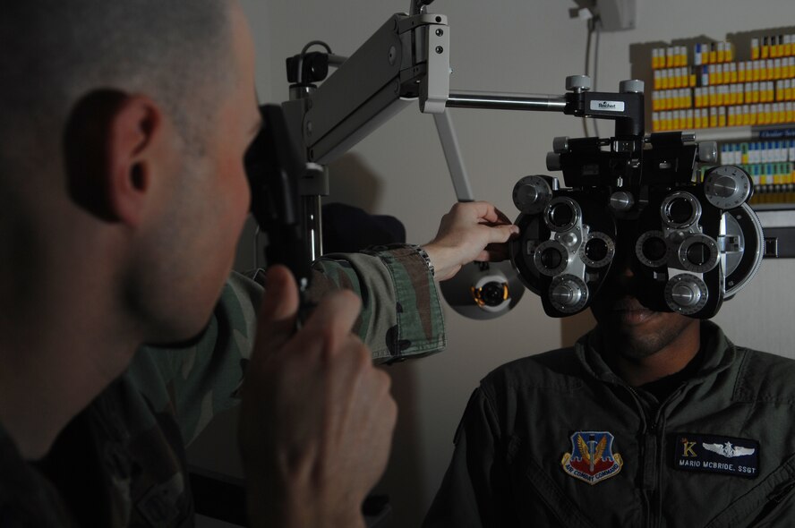 MOODY AIR FORCE BASE, Ga. – Capt. Nathan Anderson, 23rd Aerospace Dental Squadron optometrist, uses a retinoscope during an eye exam on Staff Sgt. Mario McBride, 71st Rescue Squadron loadmaster, here March 4.  The retinoscope is used to obtain an objective measurement of the refractive condition of a patient's eyes. (U.S. Air Force photo by Senior Airman Angelita Lawrence)