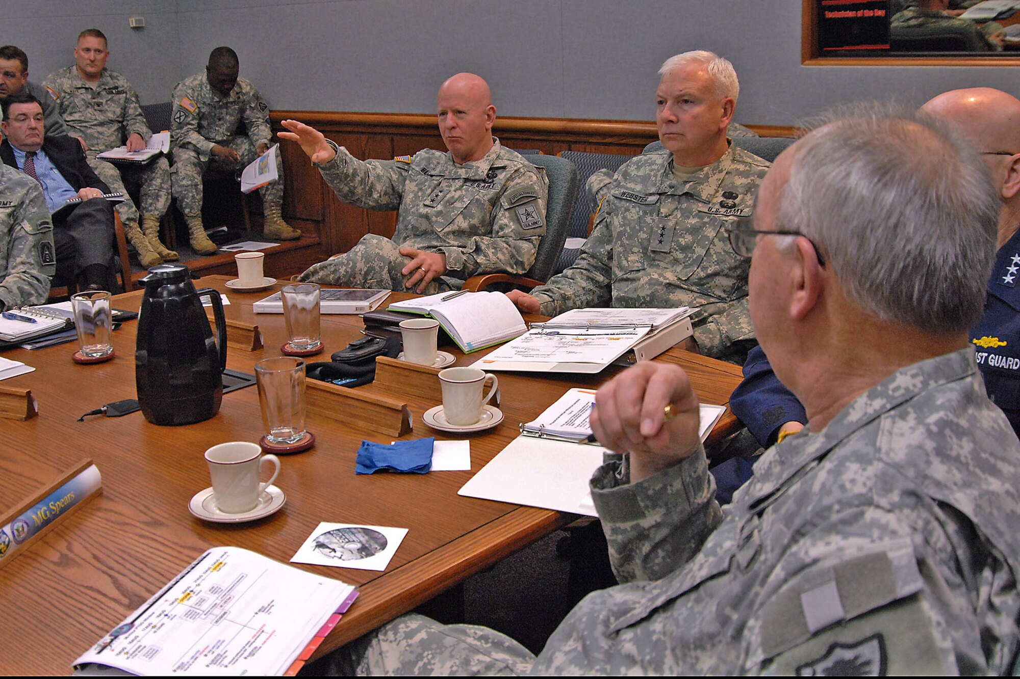 Army Lt. Gen. H Steven Blum (left), chief of the National Guard Bureau, and Lt. Gen. William Webster (center), deputy commander of U.S. Northern Command, discuss the 2007 military response to Hurricane Dean March 14 during USNORTHCOM's two-day Hurricane Preparation Conference at Peterson Air Force Base, Colo..  Adjutants general from hurricane-prone states and territories participated in the third annual conference, along with representatives from the Department of Homeland Security, FEMA, Navy, Coast Guard, Army, Air Force and Canada Command.  (U.S. Army photo/Sgt. 1st Class Gail Braymen)