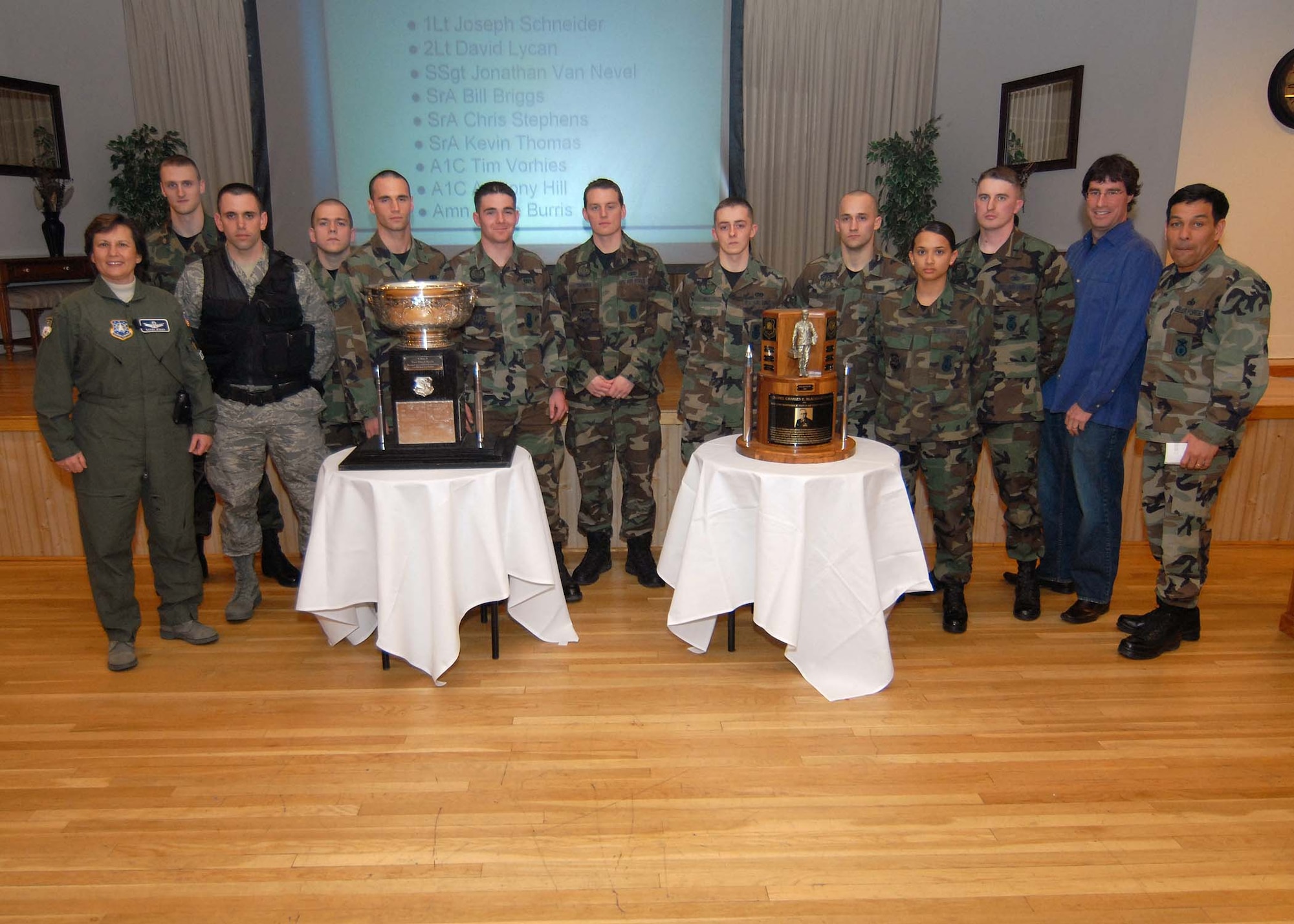The members of the 341st Security Forces Group Guardian Challenge team pose with Wing Commander Col. Sandy Finan (left), Military Affairs Committee Chairman David Weissman (second from right) and 341st SFG Commander Col. Steve Asher (right). Team members from left to right are:1st Lt. Joseph Schneider, 2nd Lt. David Lycan, Staff Sgt. Johnathan Van Nevel, Senior Airmen William Briggs and Christopher Stephens, Airmen 1st Class Kevin Thomas, Anthony Hill and Timothy Vorhies, Airman Leslie Burris, and 1st Lt. Grant Hosmer. (U.S. Air Force photo/John Turner)
